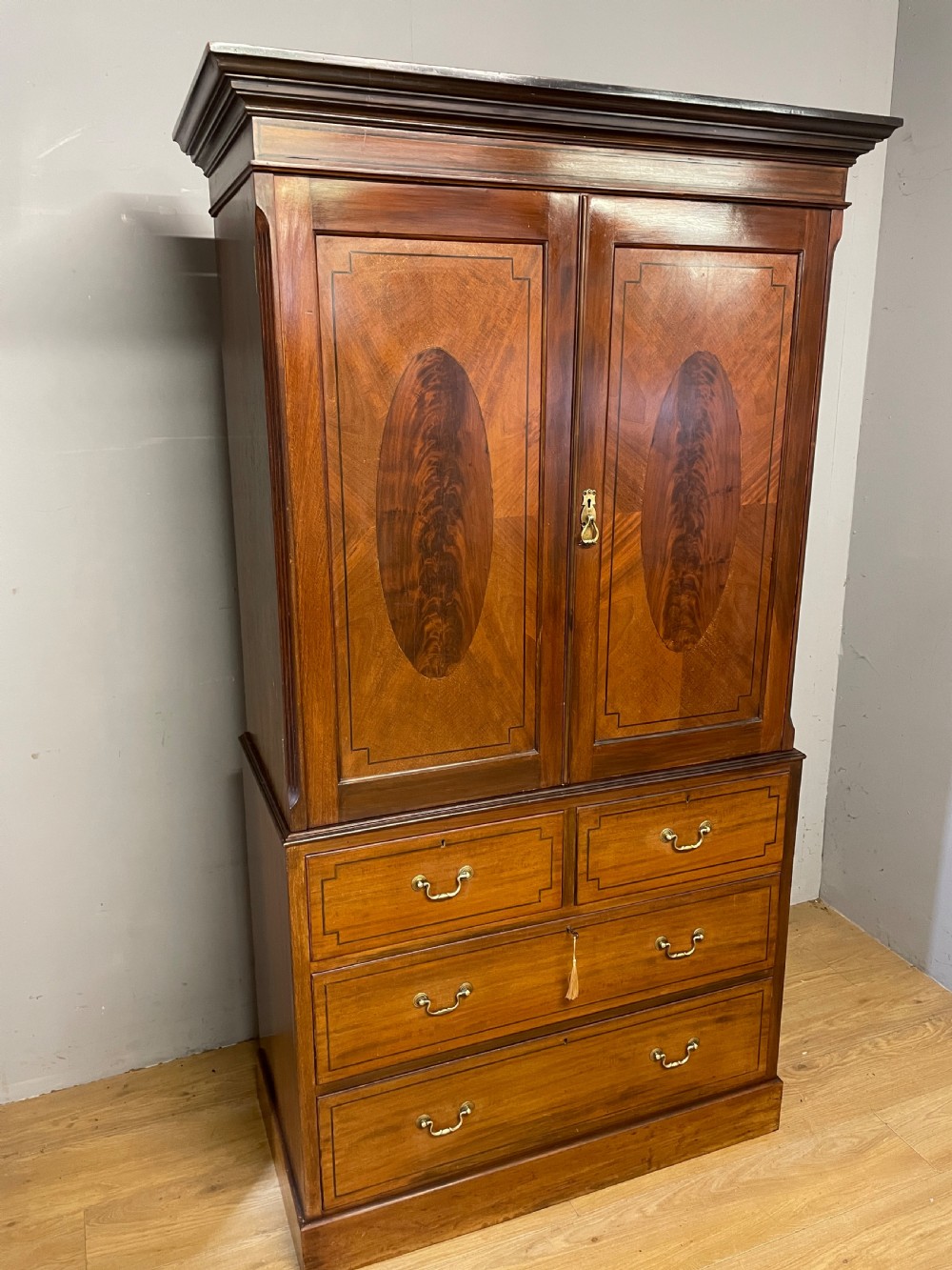 C19TH inlaid mahogany linen press by Shoolbred of London  View III