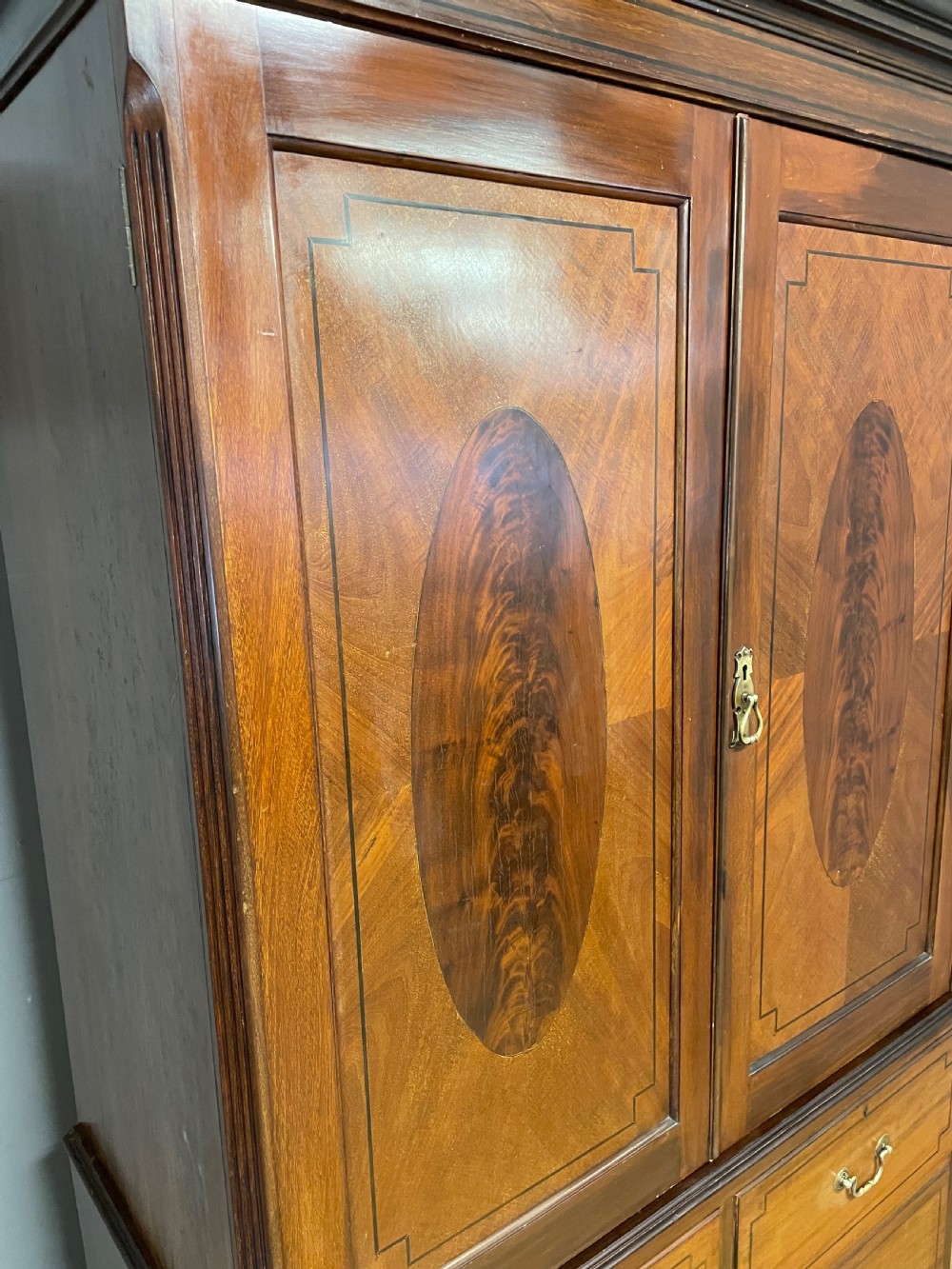 C19TH inlaid mahogany linen press by Shoolbred of London  View V