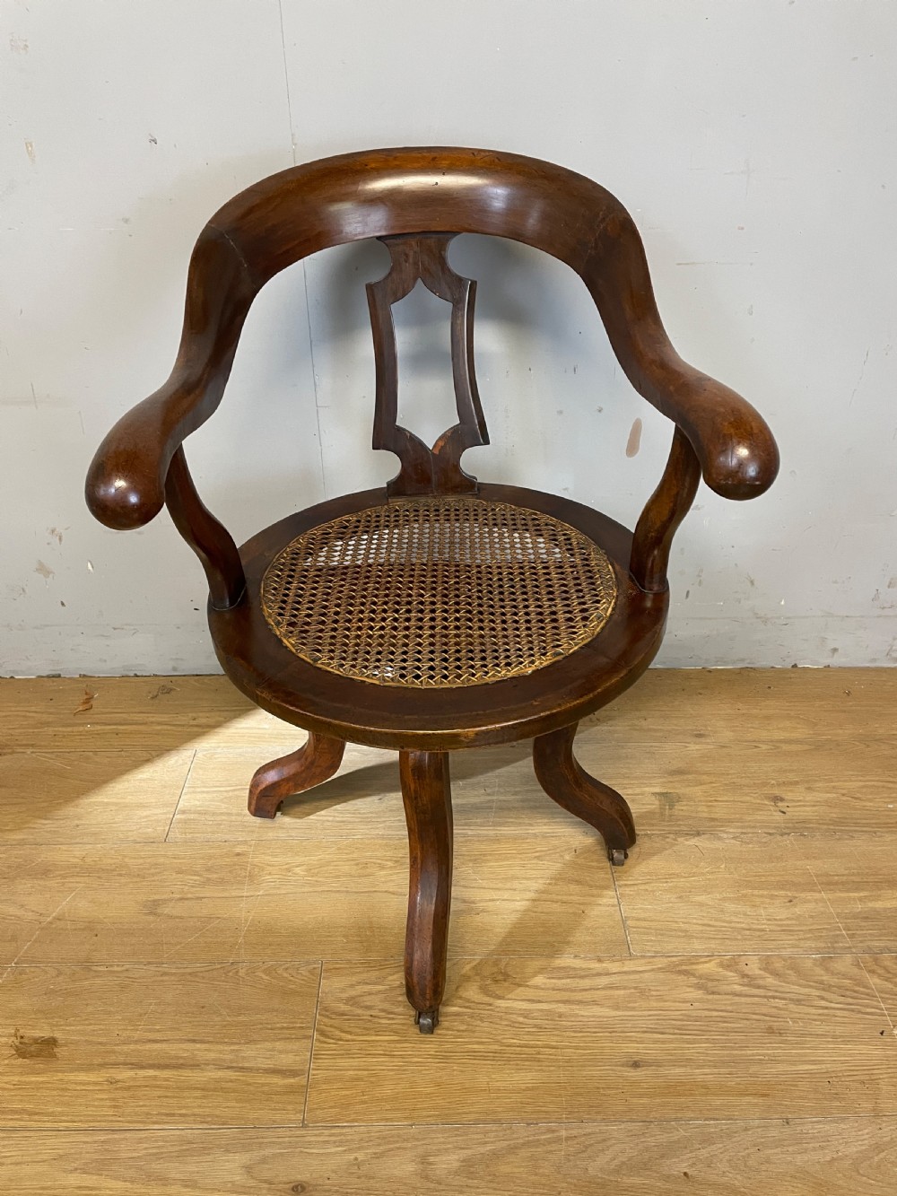 C19TH mahogany cane seated revolving desk chair View II