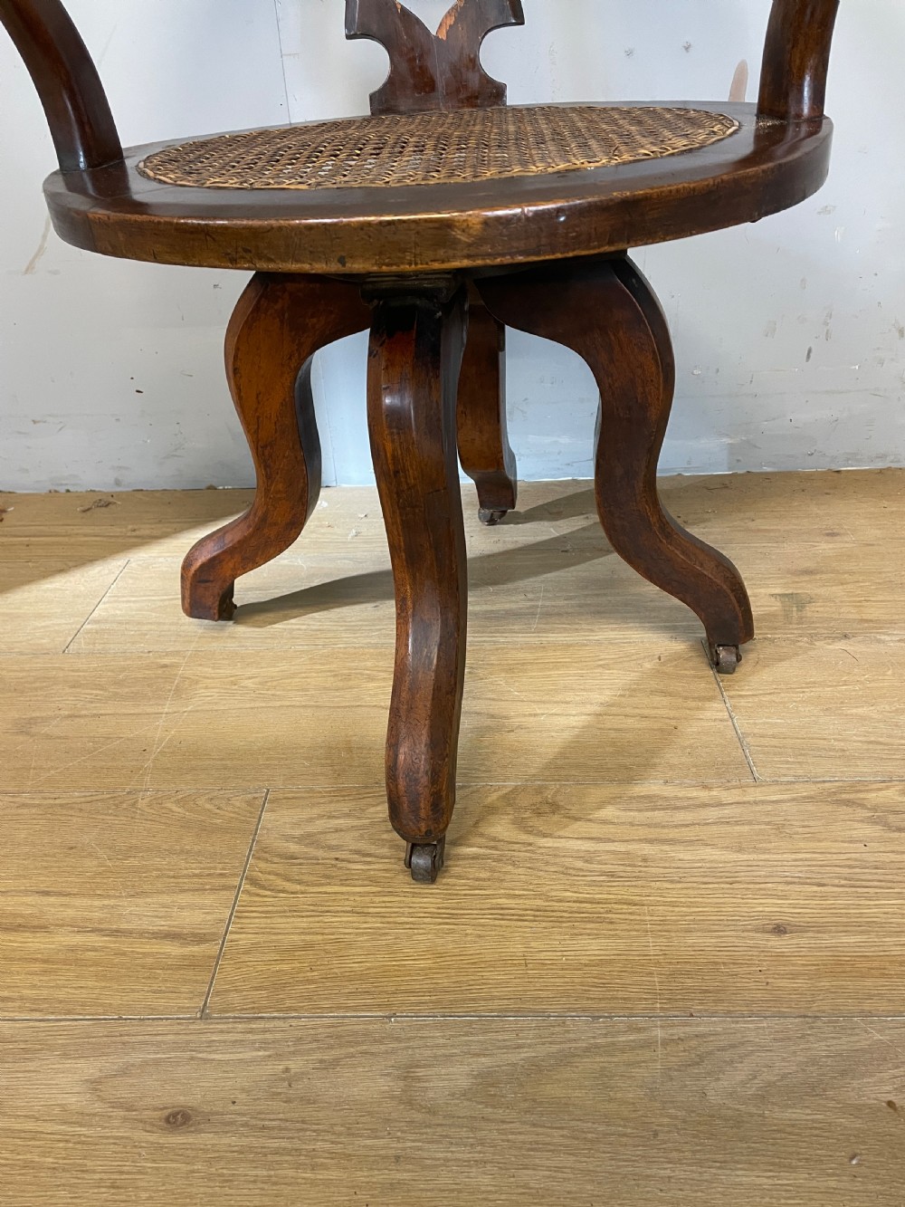 C19TH mahogany cane seated revolving desk chair View IV