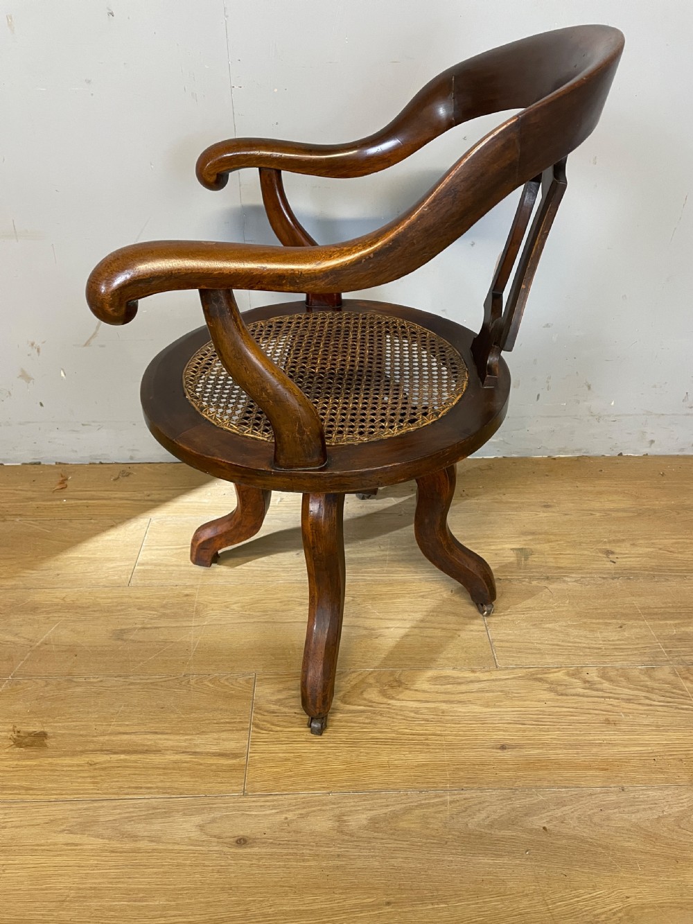 C19TH mahogany cane seated revolving desk chair View V