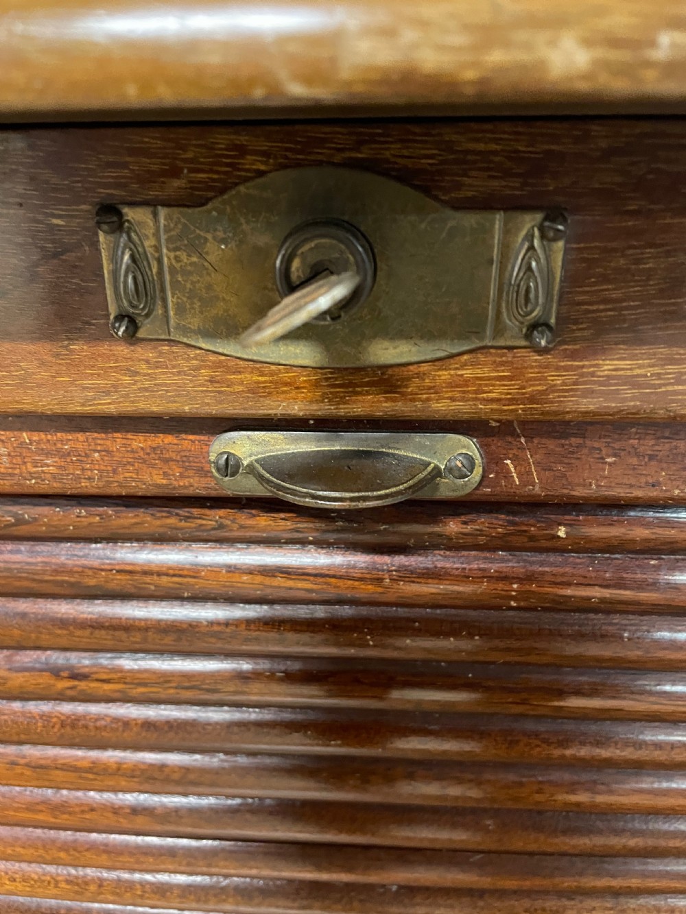 Edwardian walnut tambour fronted filing cabinet with original key  View X