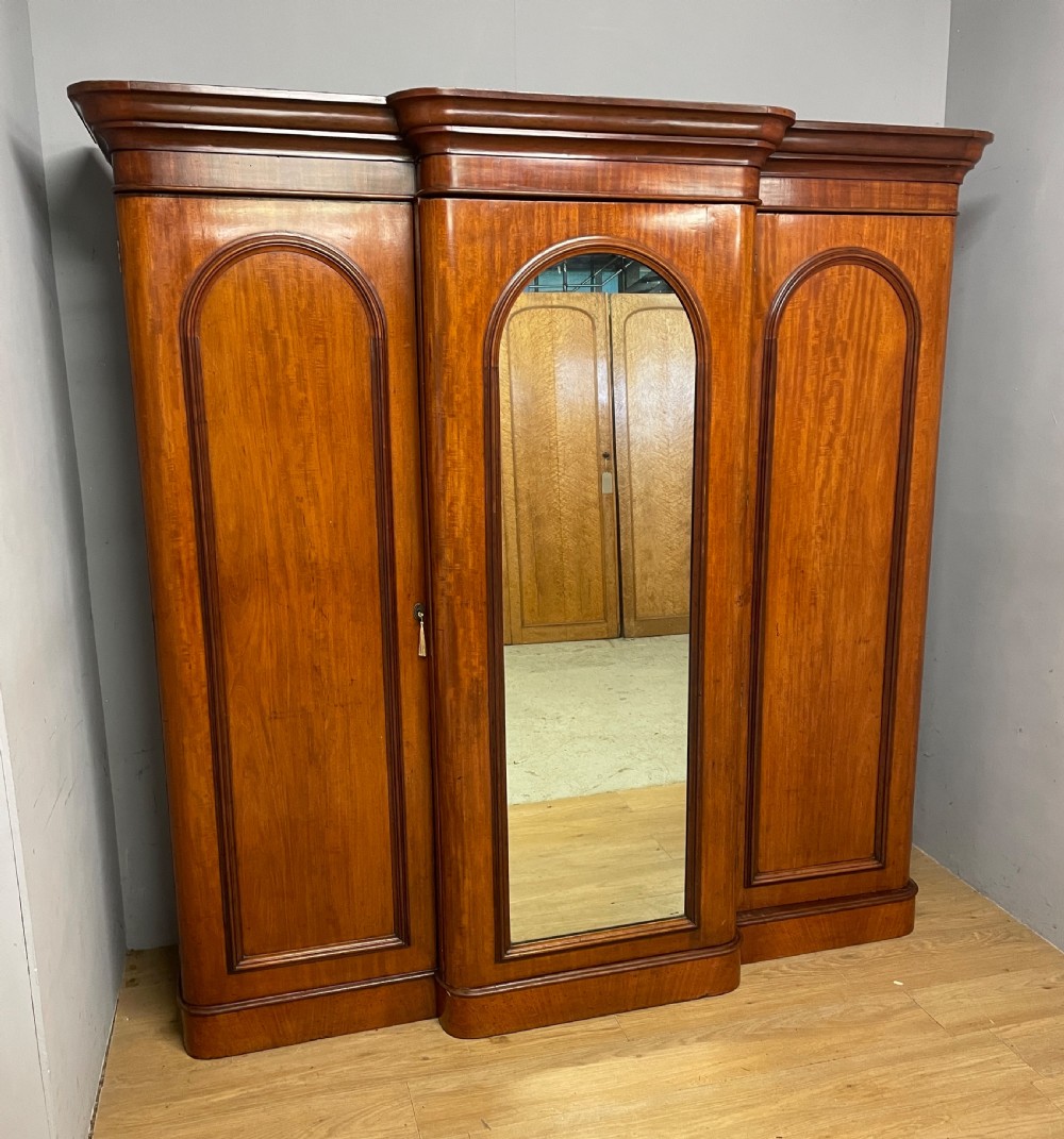 C19TH country house mahogany breakfront triple wardrobe 