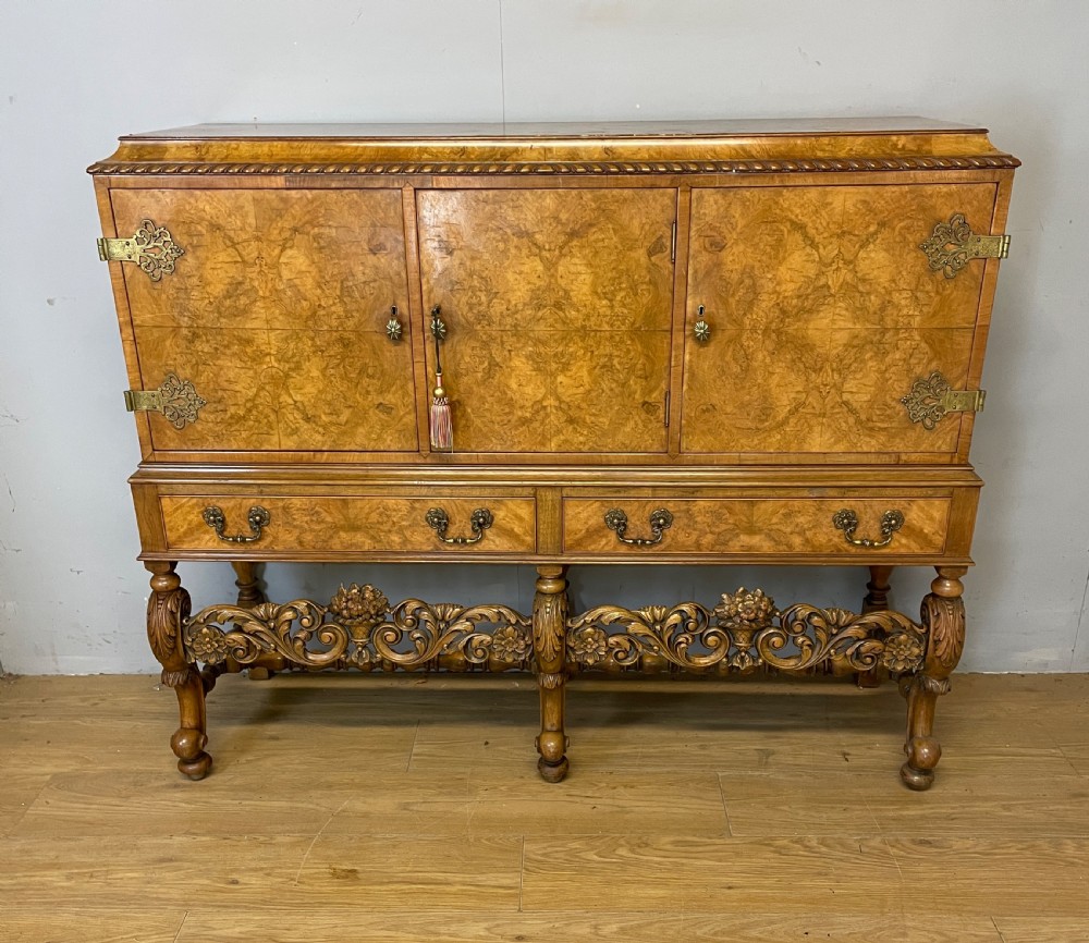 Burr walnut side cabinet on a carved base circa 1920 View II