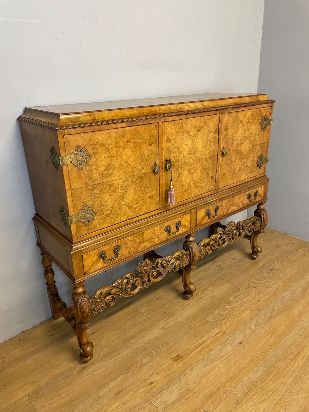 Burr walnut side cabinet on a carved base circa 1920 View III