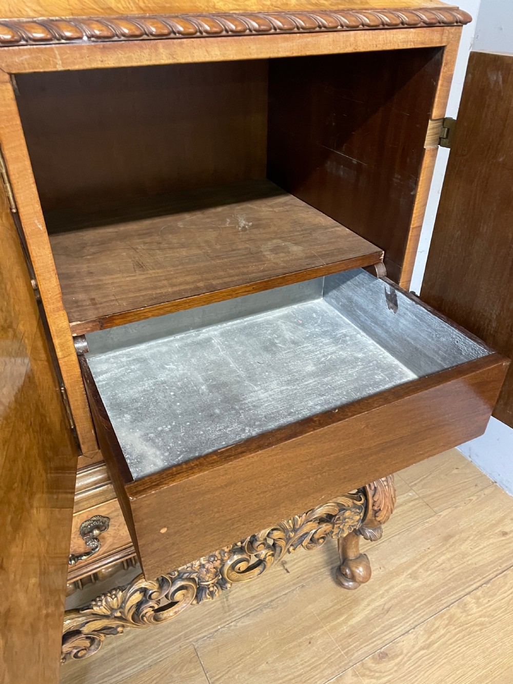 Burr walnut side cabinet on a carved base circa 1920 View V