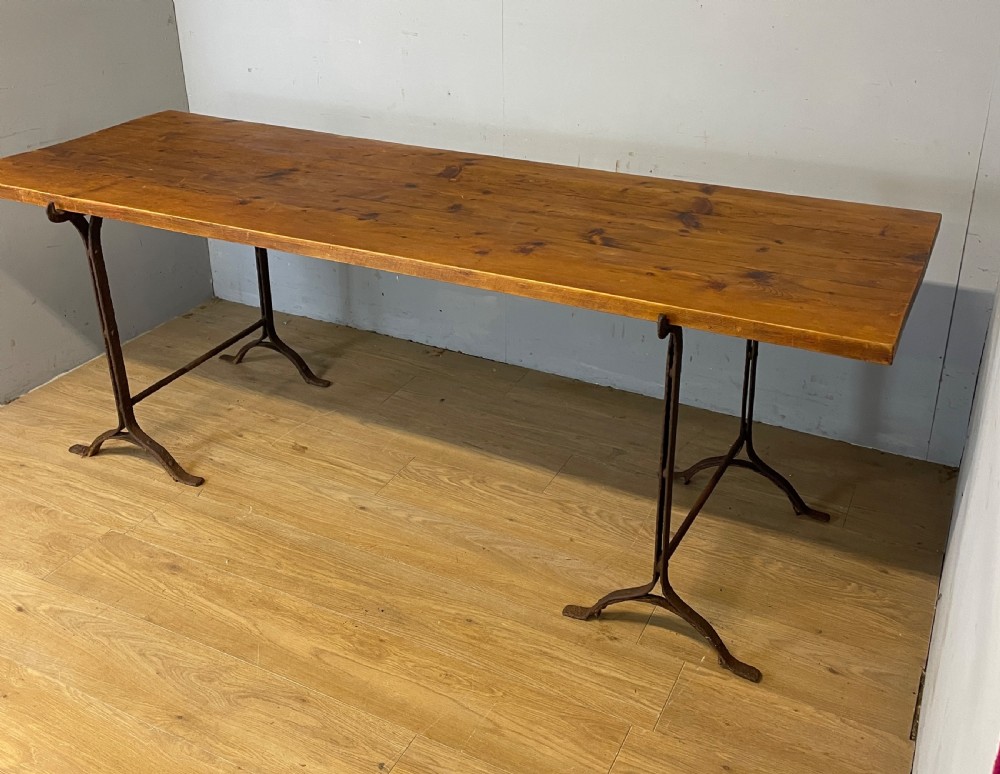 C19TH pine topped trestle table on wrought iron supports  View III