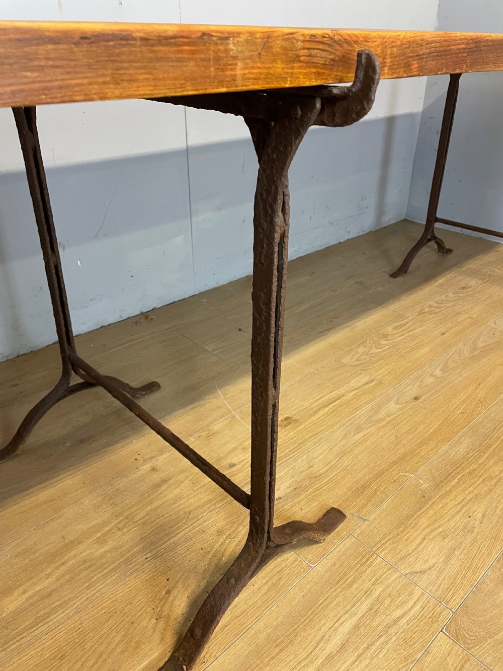 C19TH pine topped trestle table on wrought iron supports  View V