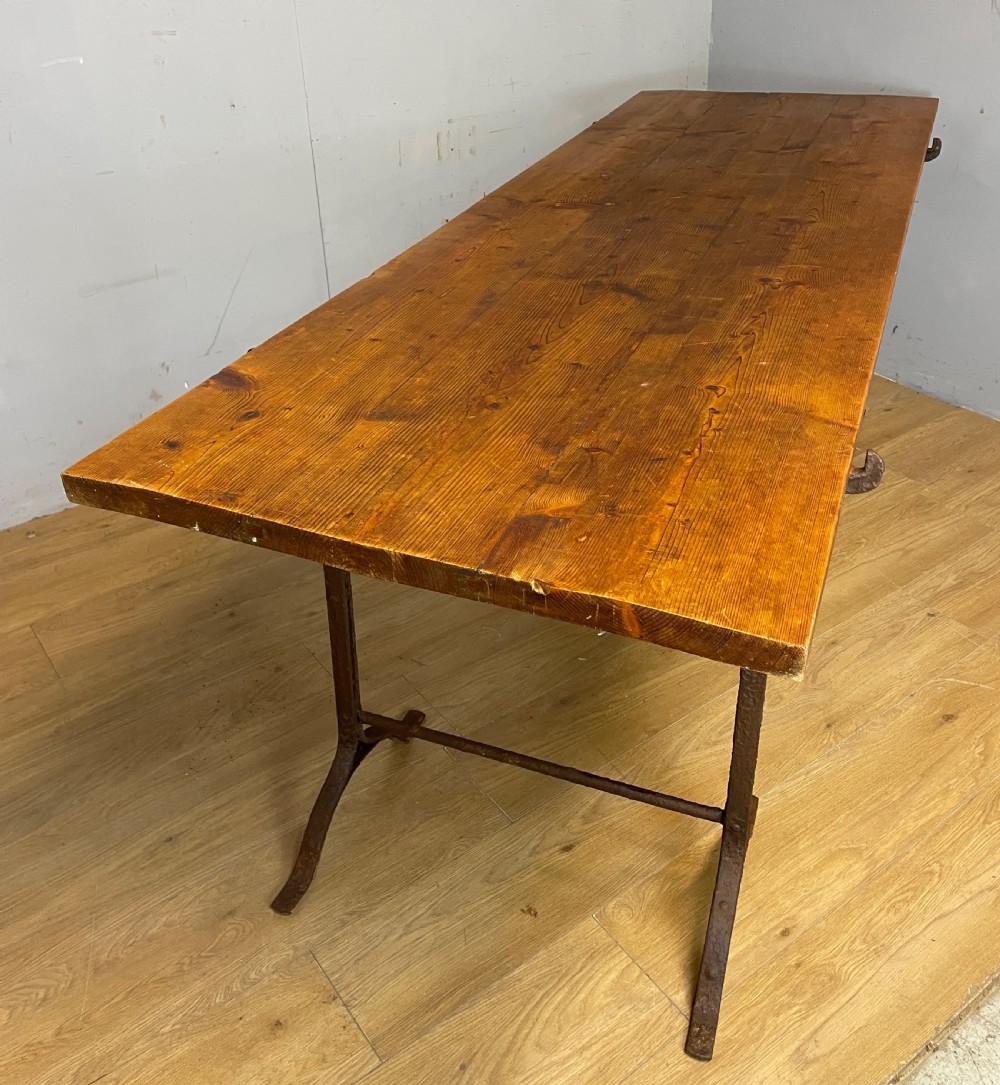C19TH pine topped trestle table on wrought iron supports  View X
