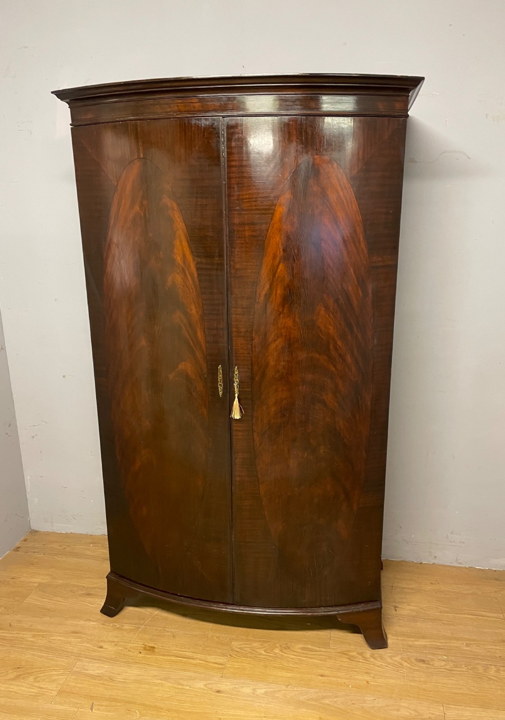 C19TH bow front flame mahogany wardrobe 