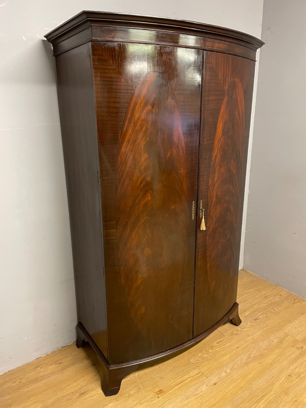C19TH bow front flame mahogany wardrobe  View III