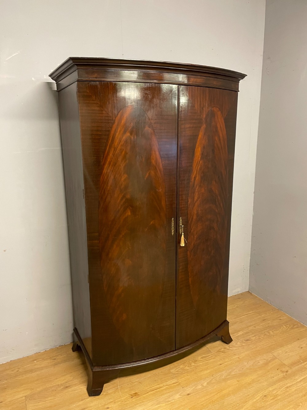 C19TH bow front flame mahogany wardrobe  View XI