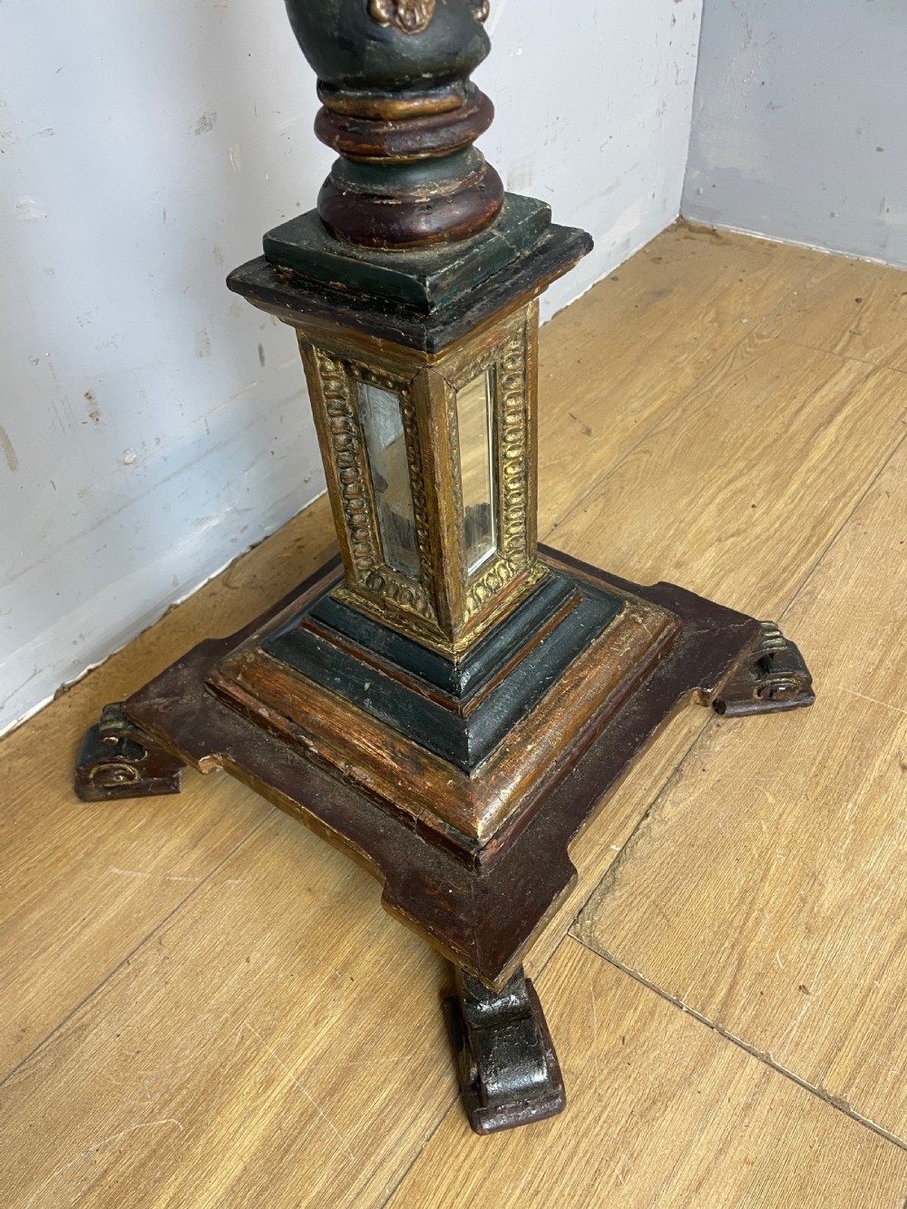 An 18th-century Italian carved wood torchere with a gilded Corinthian capital, fluted column, spiral twist shaft, and stepped base with scroll feet. View X