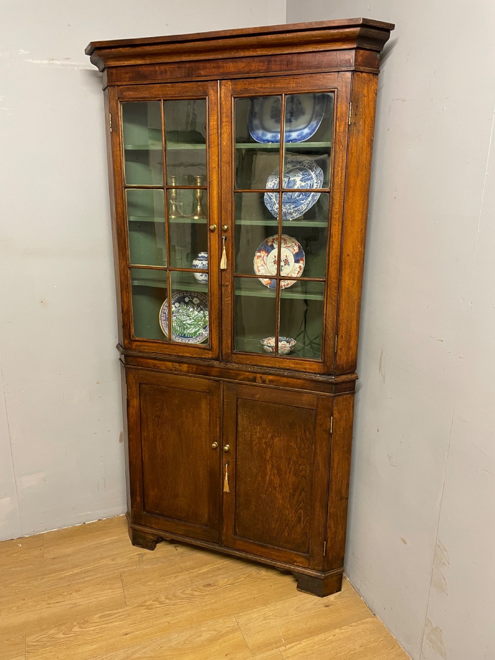 Georgian oak freestanding glazed corner cupboard circa 1790