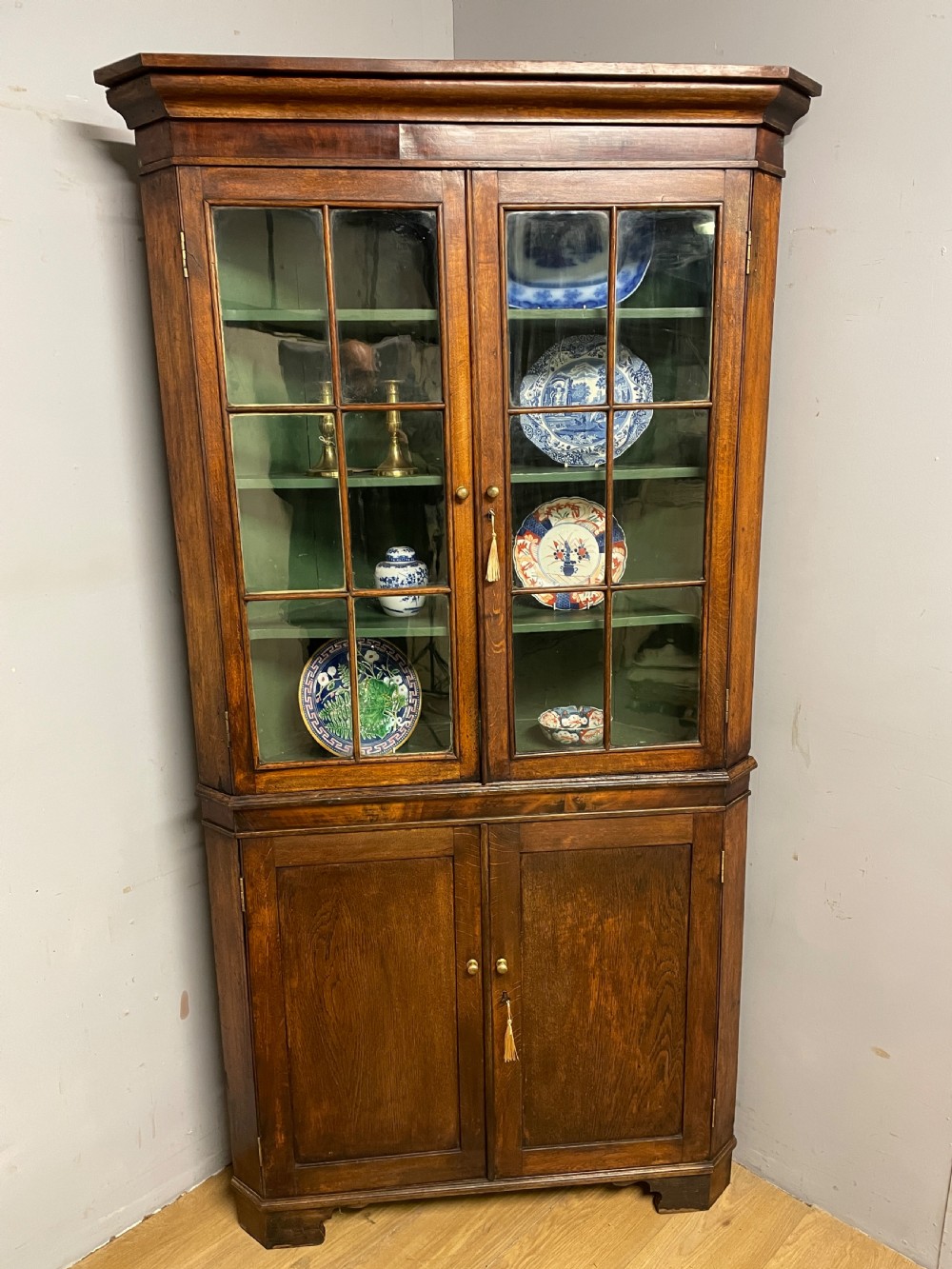 Georgian oak freestanding glazed corner cupboard circa 1790 View II