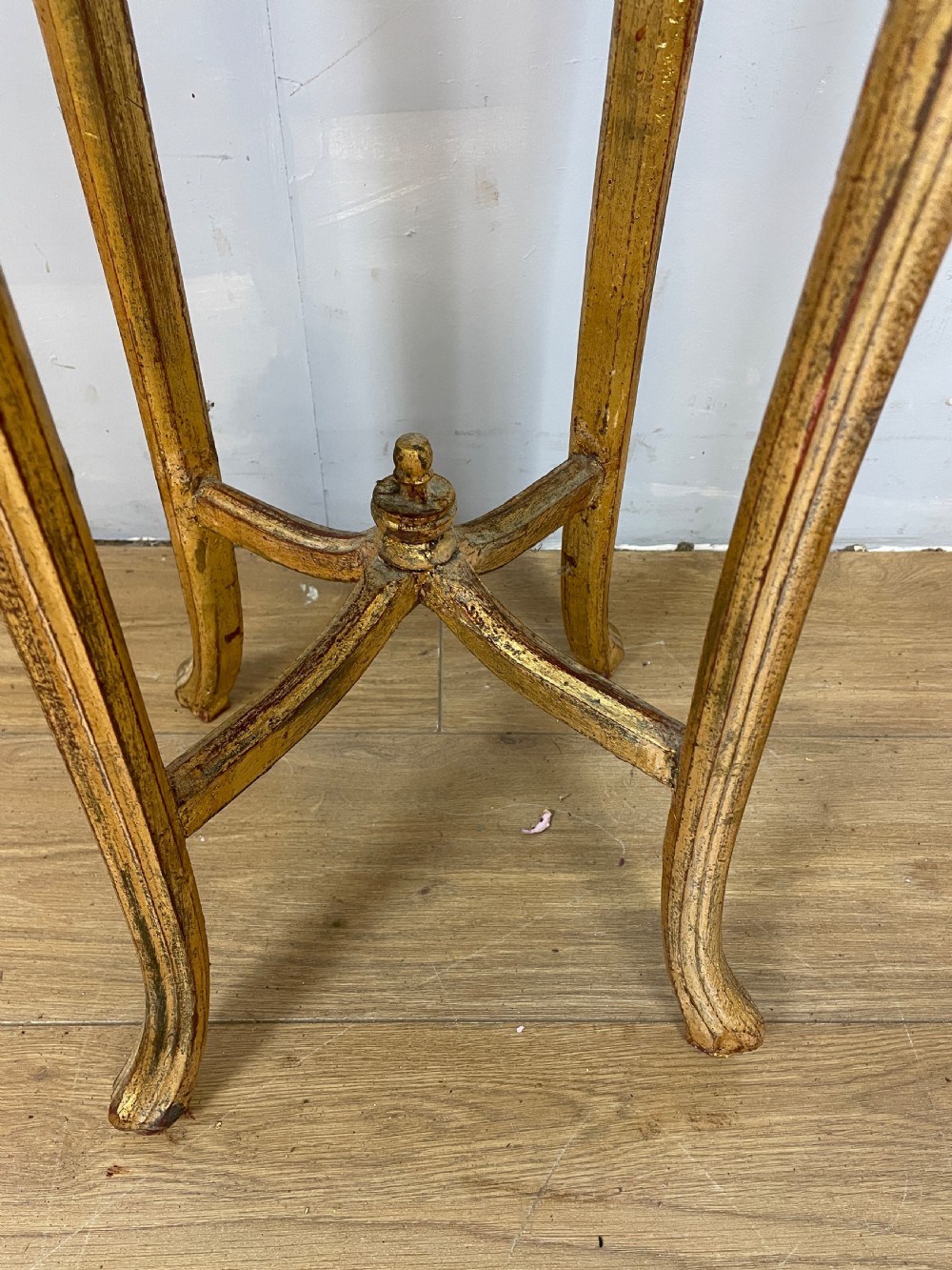 An Edwardian carved giltwood torchere featuring a circular grey marble top, slender cabriole legs, pierced aprons, and an X-frame stretcher. View II