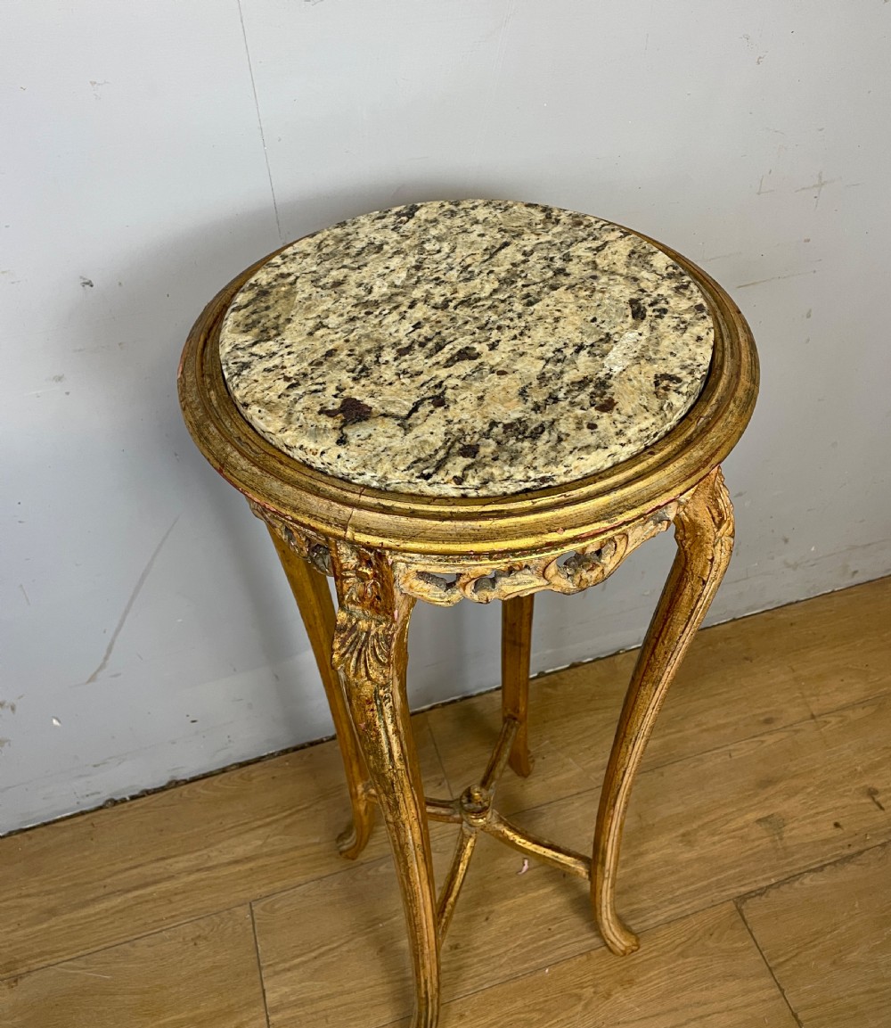 An Edwardian carved giltwood torchere featuring a circular grey marble top, slender cabriole legs, pierced aprons, and an X-frame stretcher. View VI