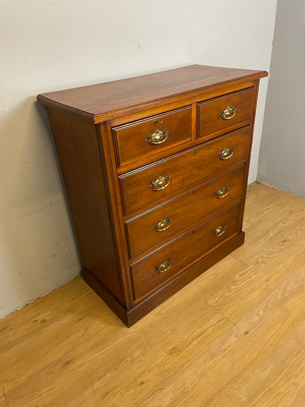 Late C19TH walnut four height chest of drawers with solid brass handles  View II