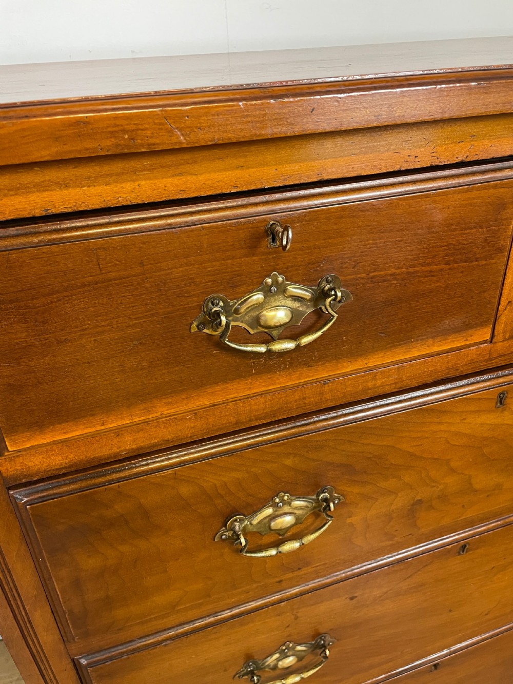 Late C19TH walnut four height chest of drawers with solid brass handles  View III