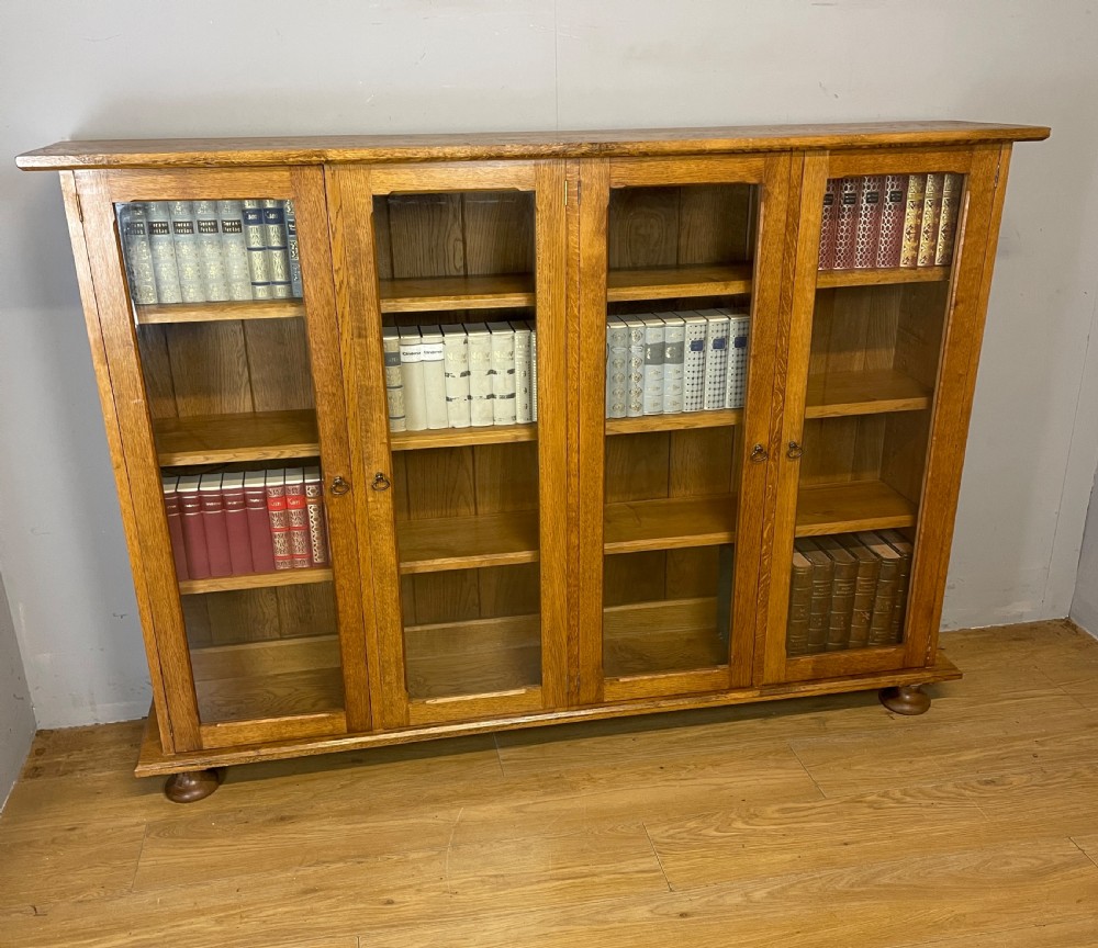 Arts and Crafts golden oak freestanding four  door glazed bookcase  View II