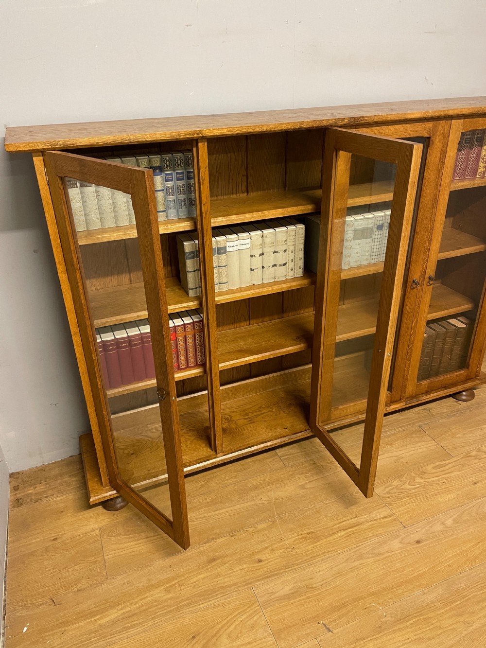 Arts and Crafts golden oak freestanding four  door glazed bookcase  View VII