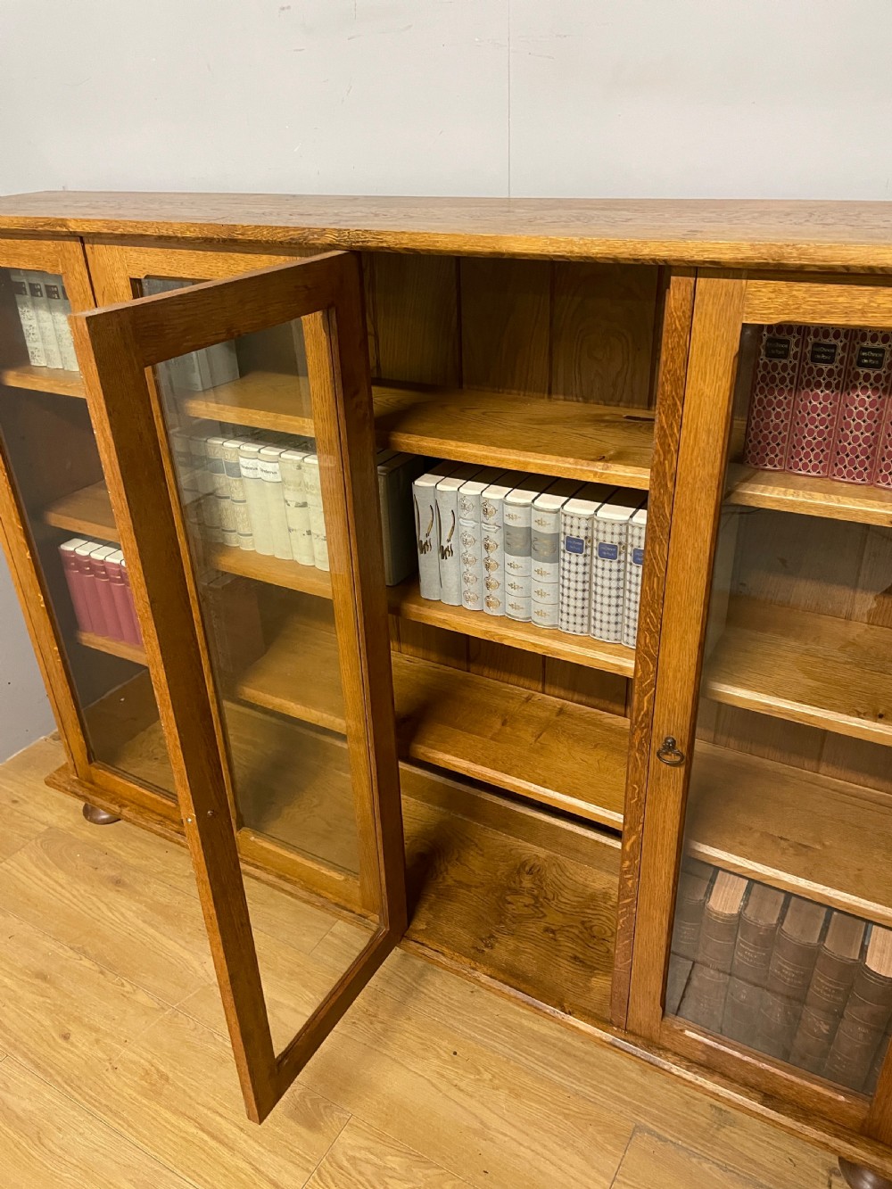Arts and Crafts golden oak freestanding four  door glazed bookcase  View VIII