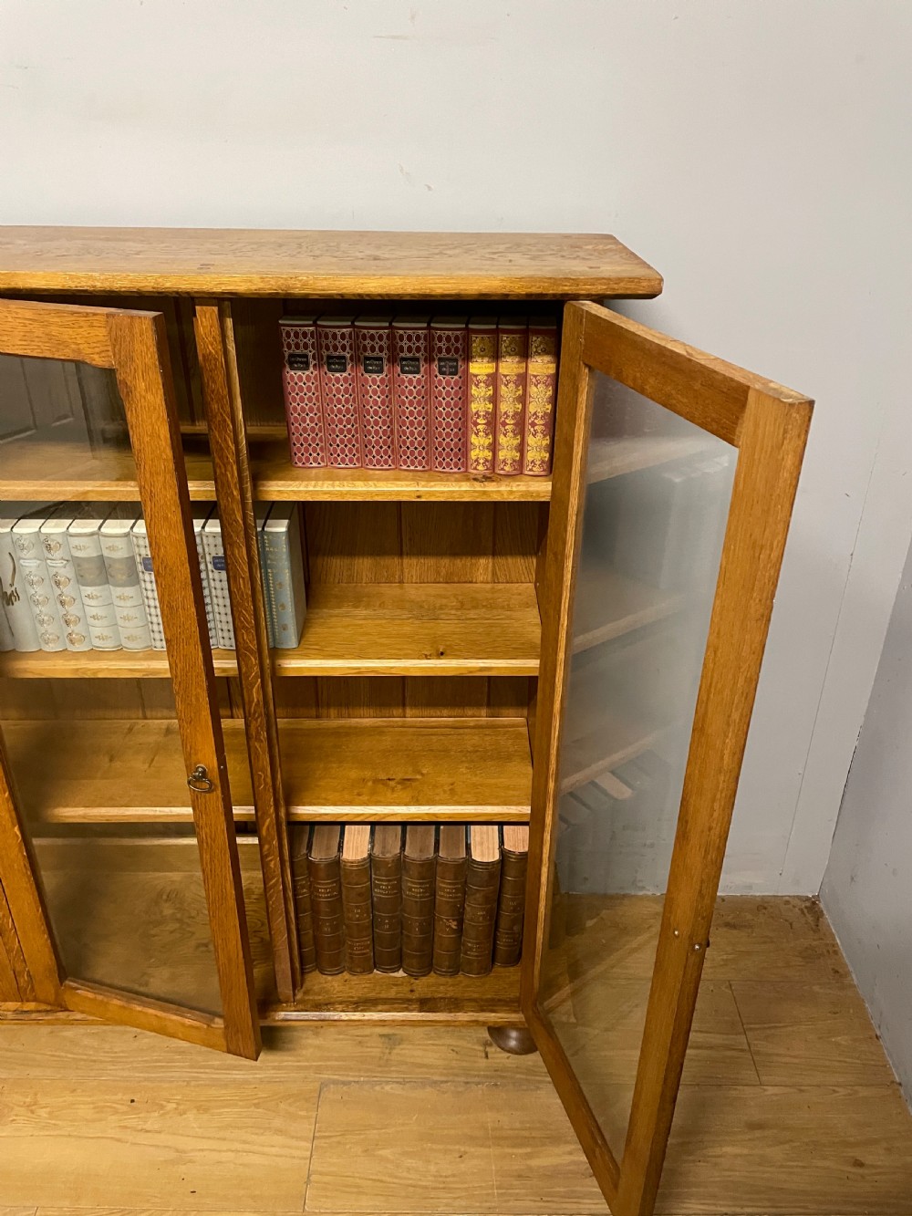 Arts and Crafts golden oak freestanding four  door glazed bookcase  View IX