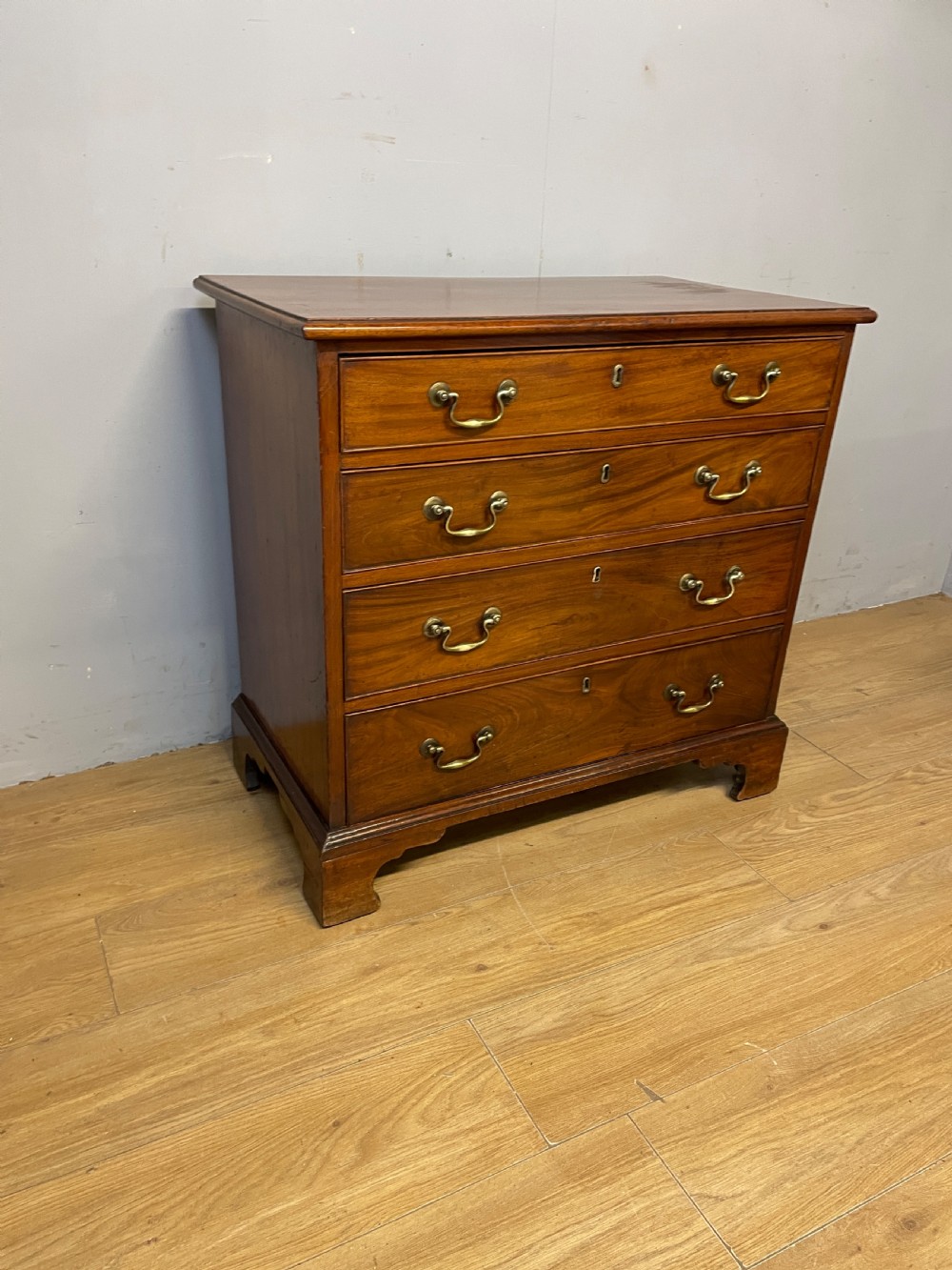 Small Georgian mahogany chest of drawers circa 1820 on bracket feet  View II