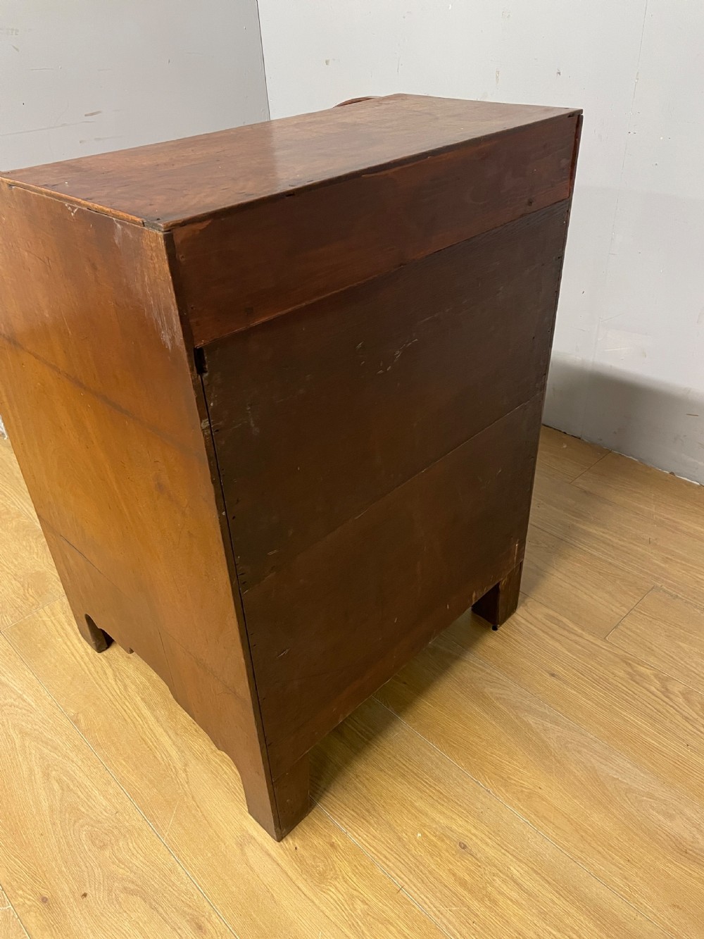 A Georgian mahogany bureau cabinet featuring a curved slatted tambour shutter above four small drawers and two wide drawers with brass handles. View VI
