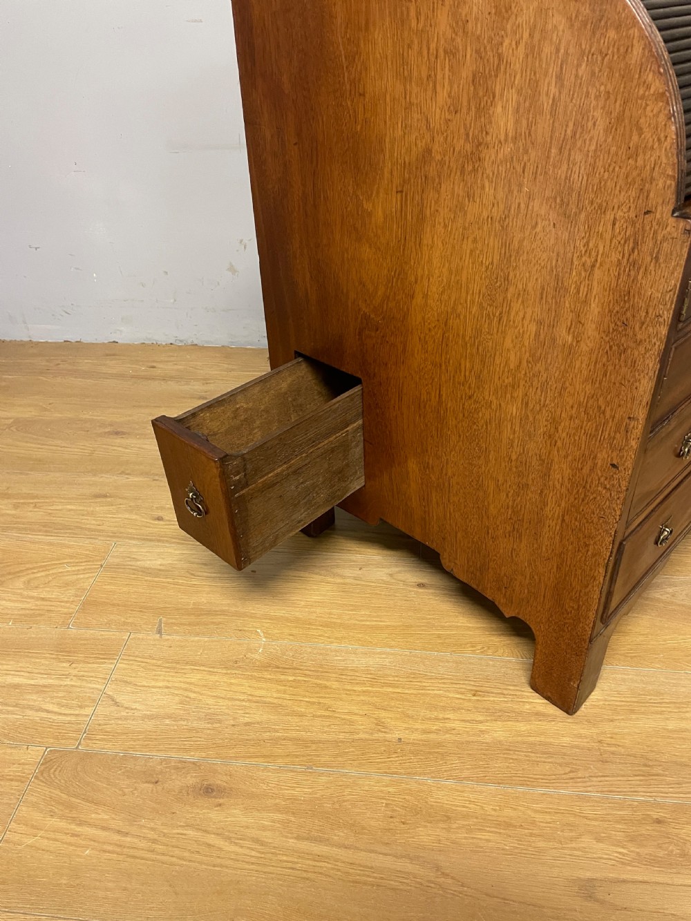A Georgian mahogany bureau cabinet featuring a curved slatted tambour shutter above four small drawers and two wide drawers with brass handles. View XVII