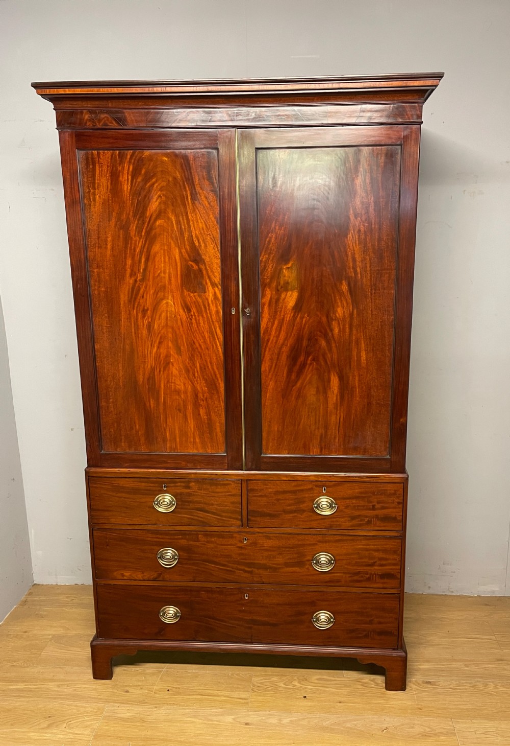 Georgian flame  mahogany linen press circa 1800 