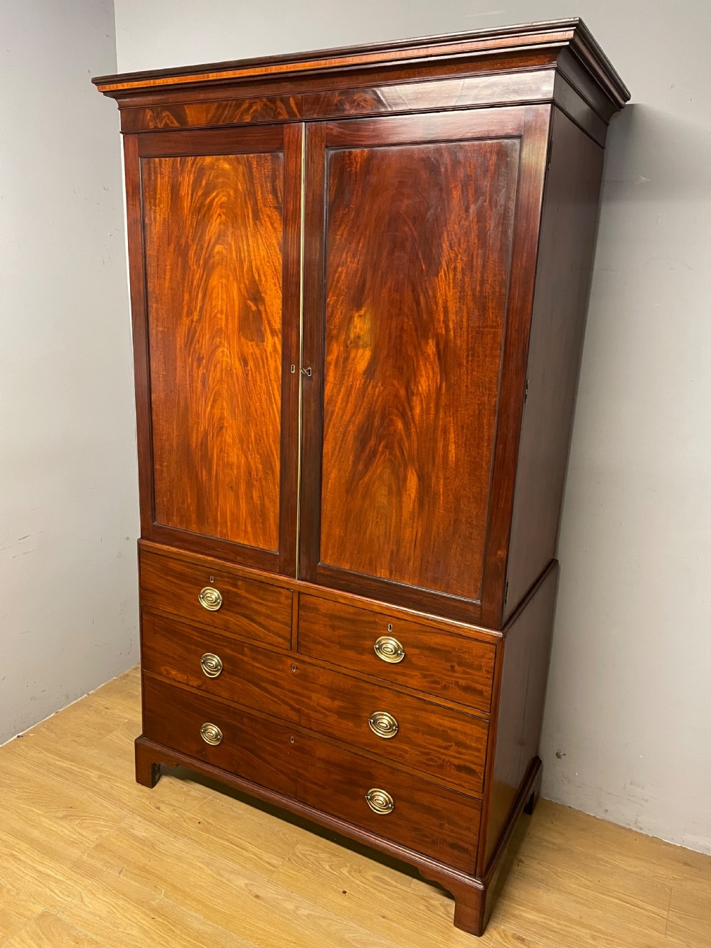 Georgian flame  mahogany linen press circa 1800  View II