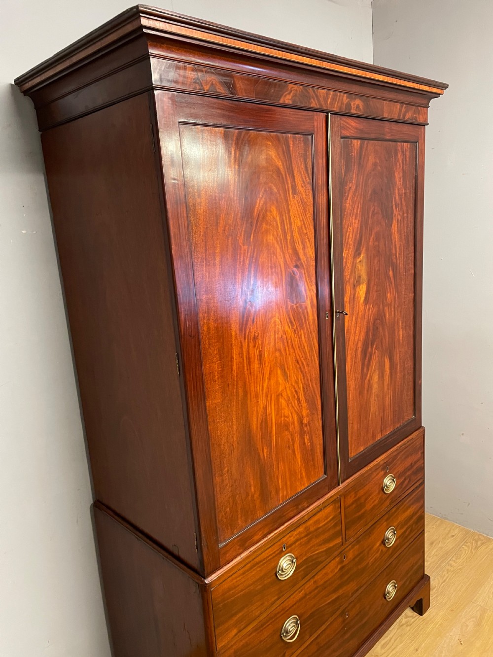 Georgian flame  mahogany linen press circa 1800  View III