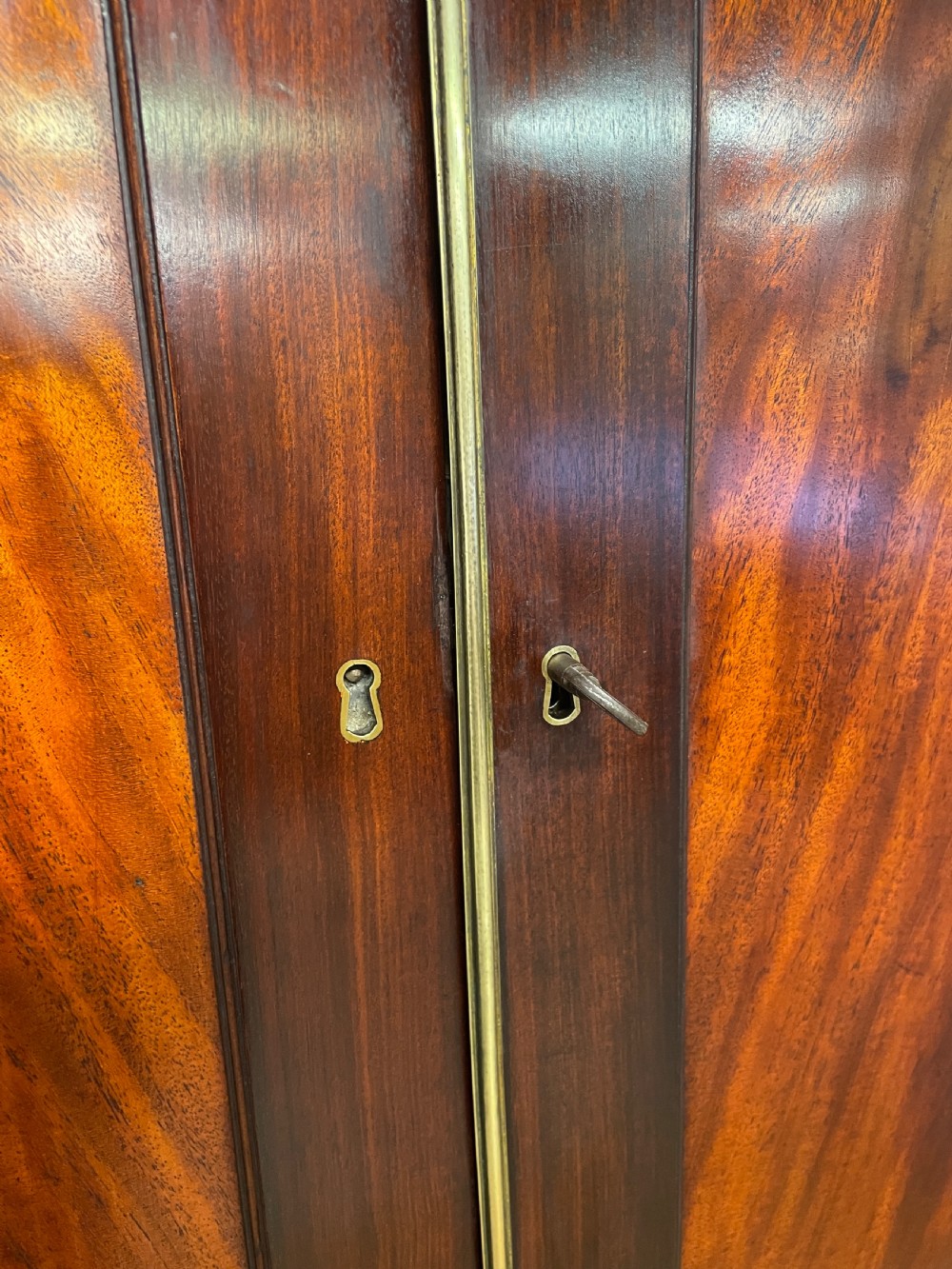Georgian flame  mahogany linen press circa 1800  View V