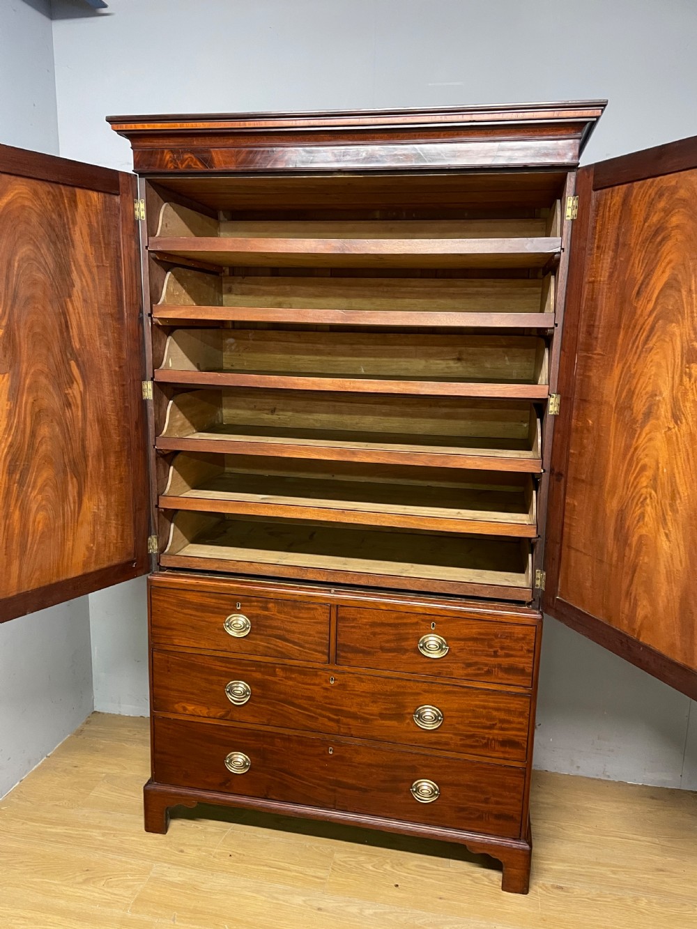 Georgian flame  mahogany linen press circa 1800  View VI