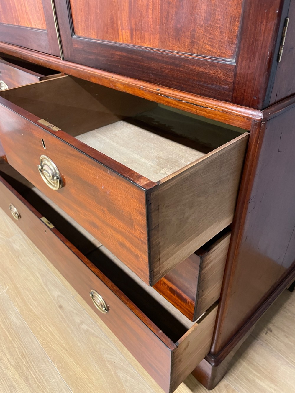 Georgian flame  mahogany linen press circa 1800  View VIII