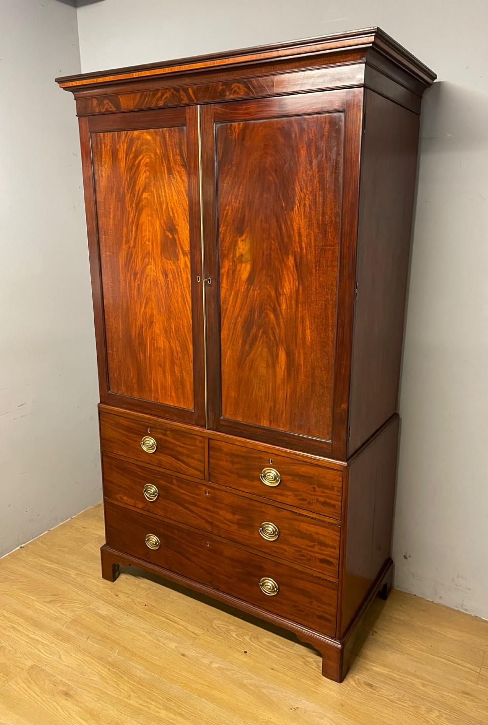 Georgian flame  mahogany linen press circa 1800  View XI
