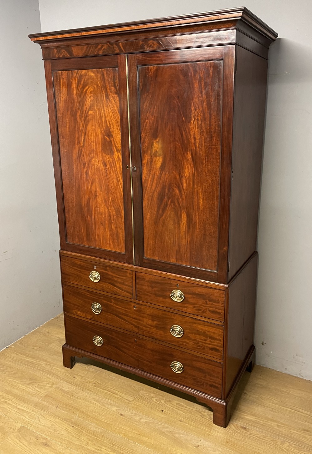 Georgian flame  mahogany linen press circa 1800  View XIII
