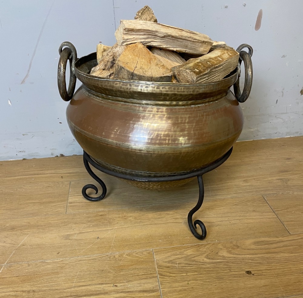 Oriental brass log bin on iron tripod stand circa 1920