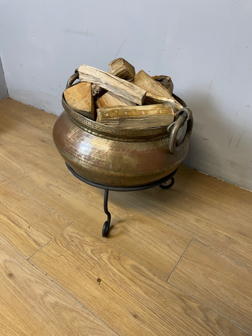 Oriental brass log bin on iron tripod stand circa 1920 View II
