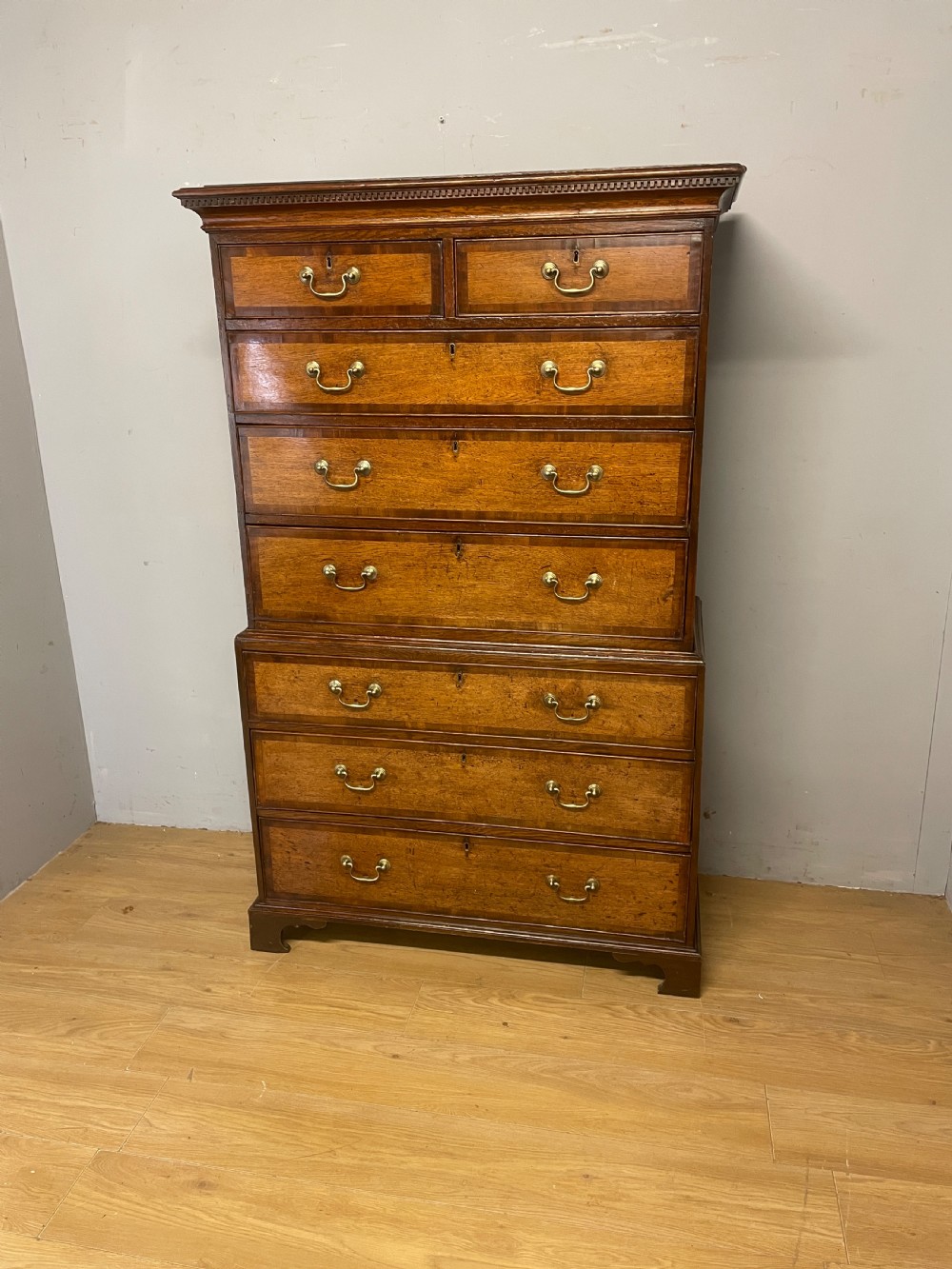 Georgian oak chest on chest with brass swan neck handles and mahogany cross banded drawers 