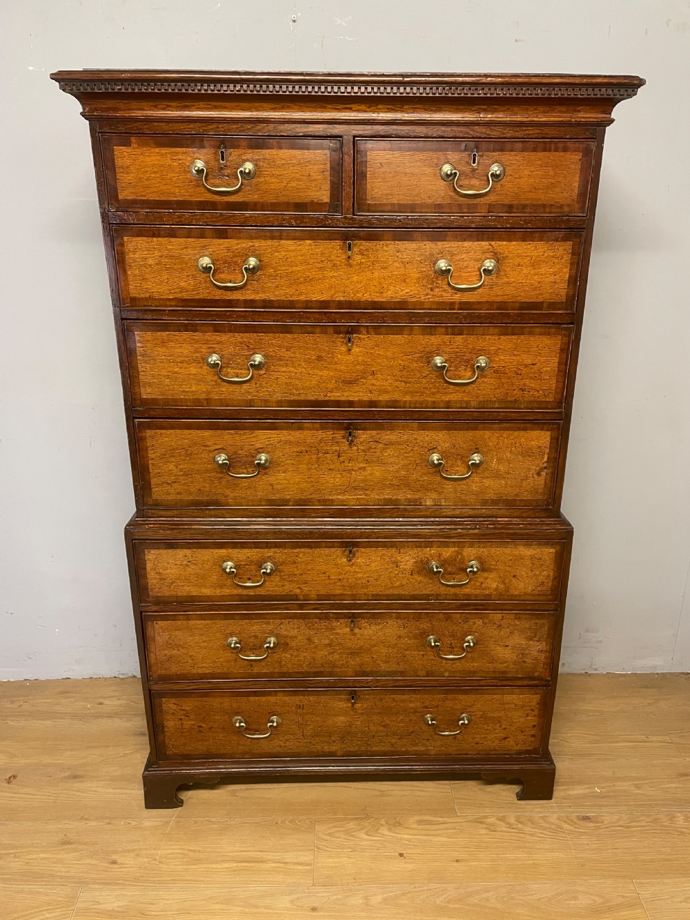 Georgian oak chest on chest with brass swan neck handles and mahogany cross banded drawers  View III