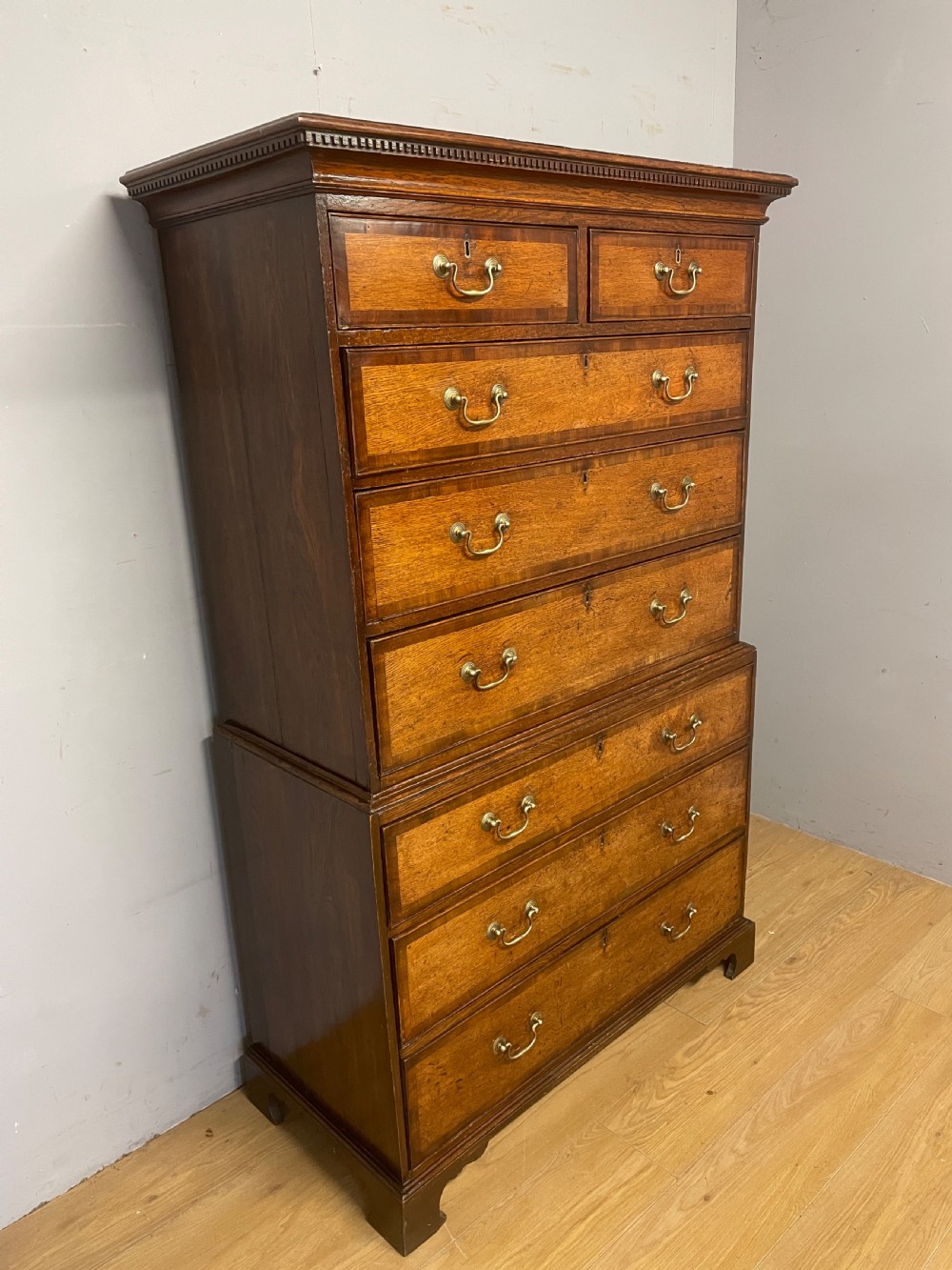 Georgian oak chest on chest with brass swan neck handles and mahogany cross banded drawers  View IV