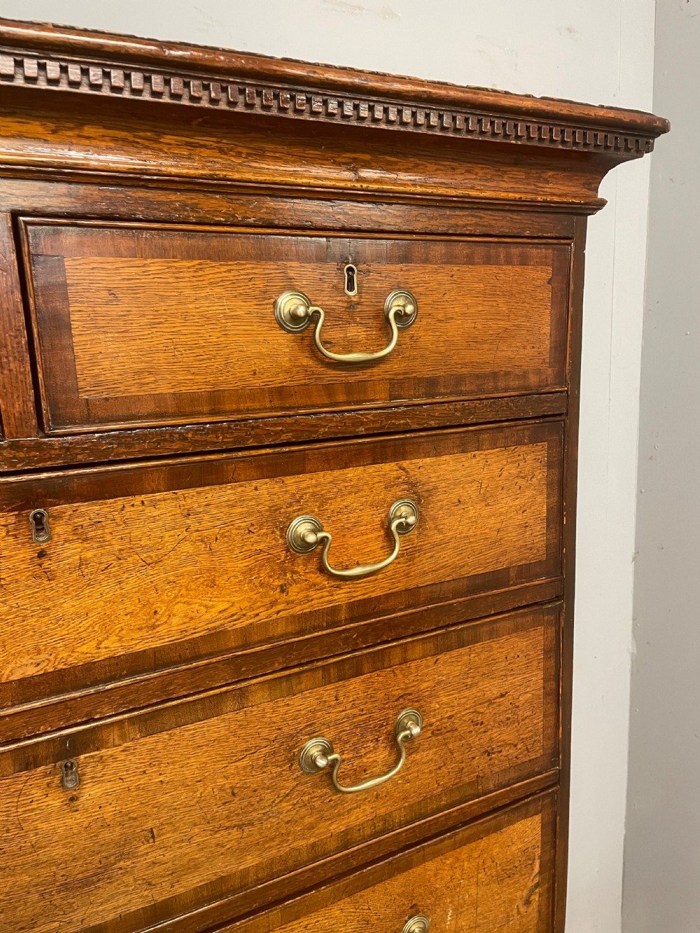 Georgian oak chest on chest with brass swan neck handles and mahogany cross banded drawers  View VI