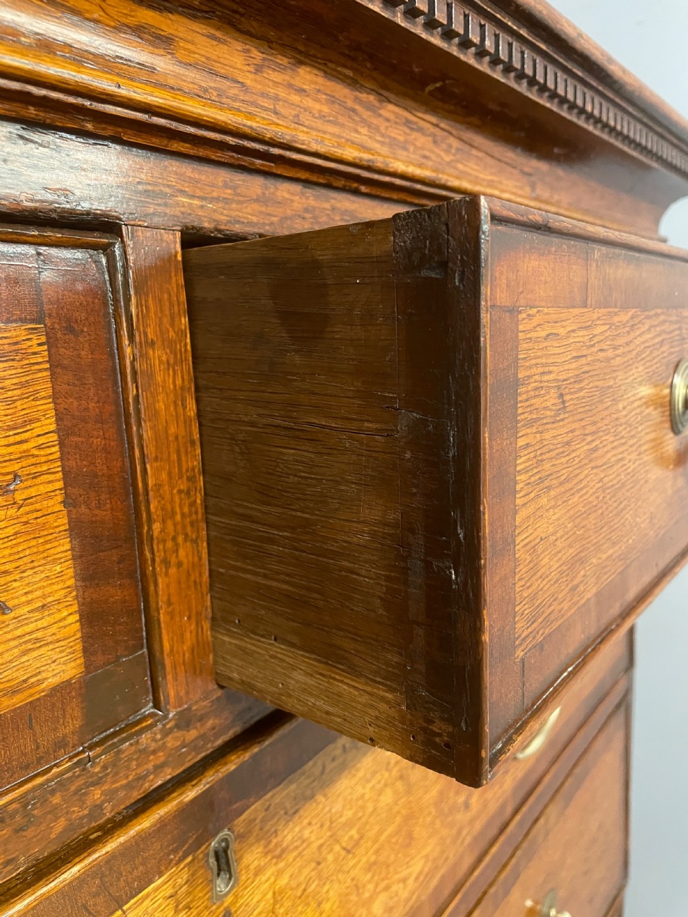Georgian oak chest on chest with brass swan neck handles and mahogany cross banded drawers  View VII