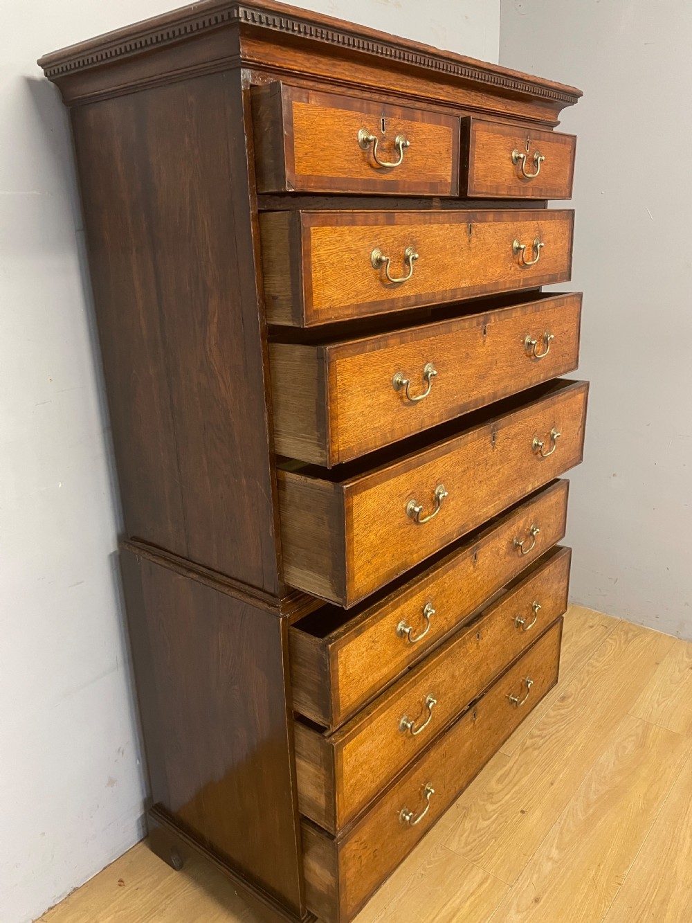 Georgian oak chest on chest with brass swan neck handles and mahogany cross banded drawers  View X