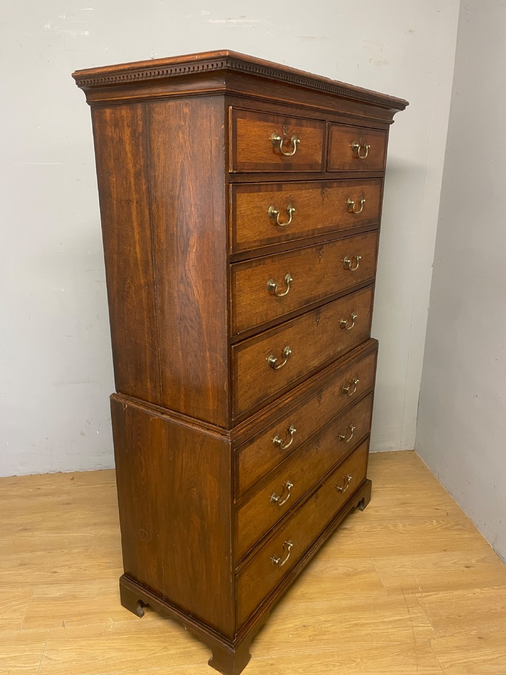 Georgian oak chest on chest with brass swan neck handles and mahogany cross banded drawers  View XII