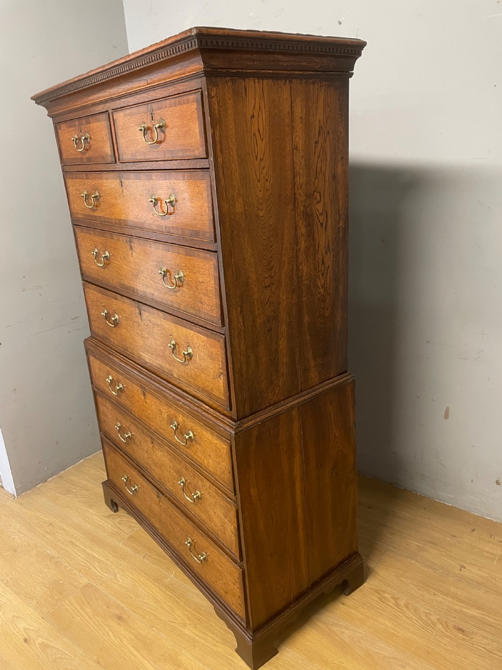 Georgian oak chest on chest with brass swan neck handles and mahogany cross banded drawers  View XIII