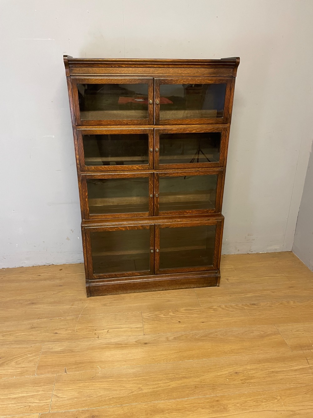 Edwardian oak sectional bookcase with glazed doors (by Minty of Oxford) View III