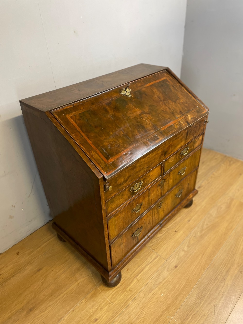Early eighteenth century walnut bureau on original bun feet  View IV